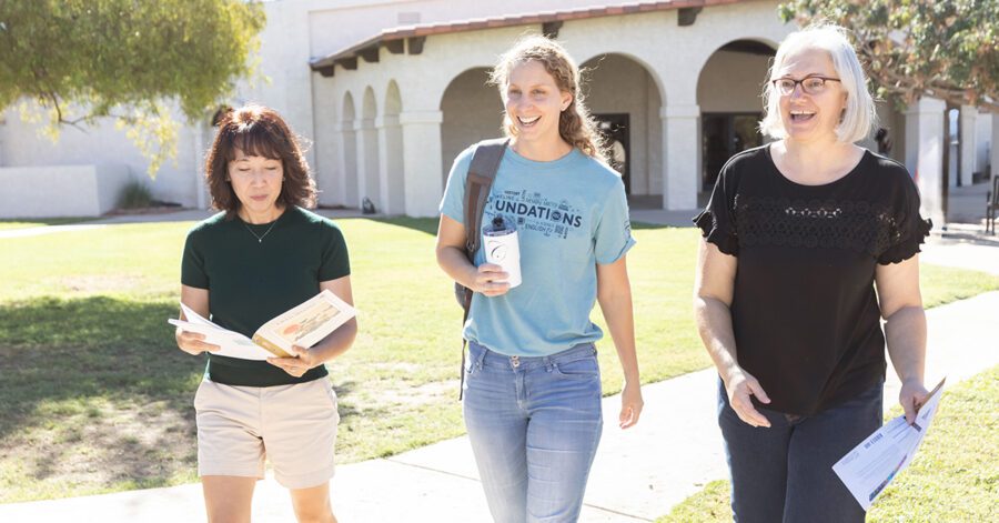 Three women walking outside a Classical Conversations Parent Practicum.