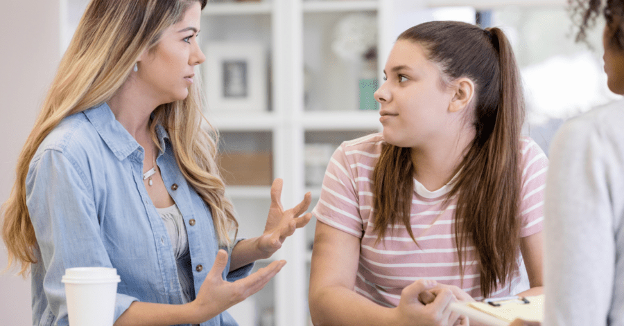 A mother and daughter practice Latin.