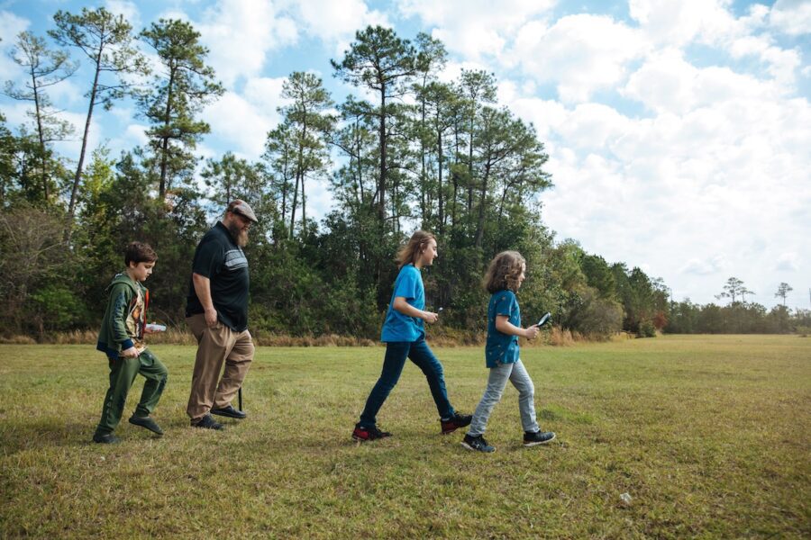 A homeschool family walking outside