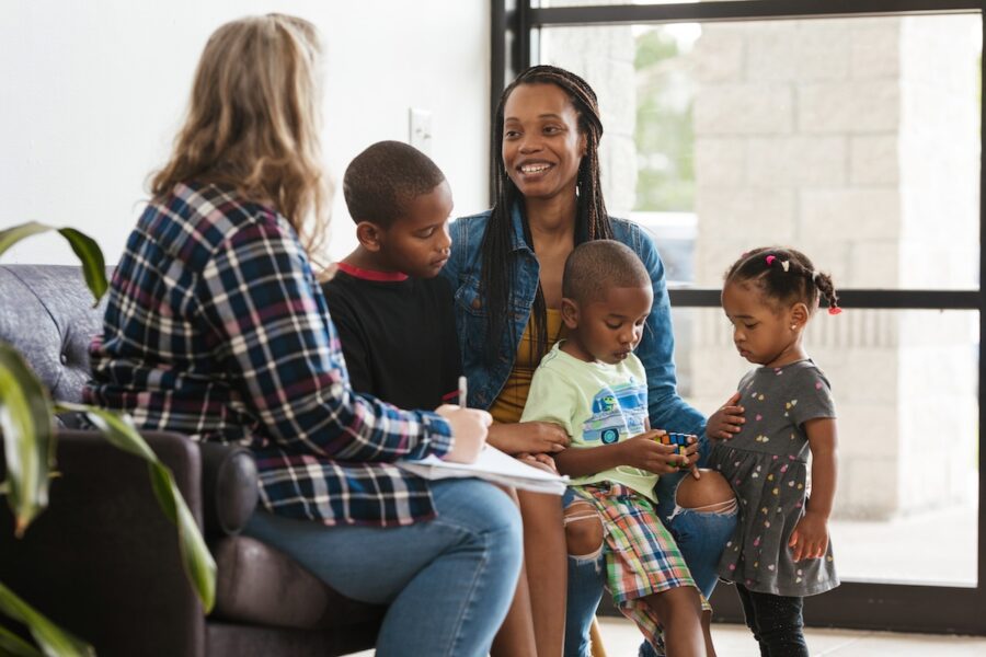 Families talking at a Classical Conversations community