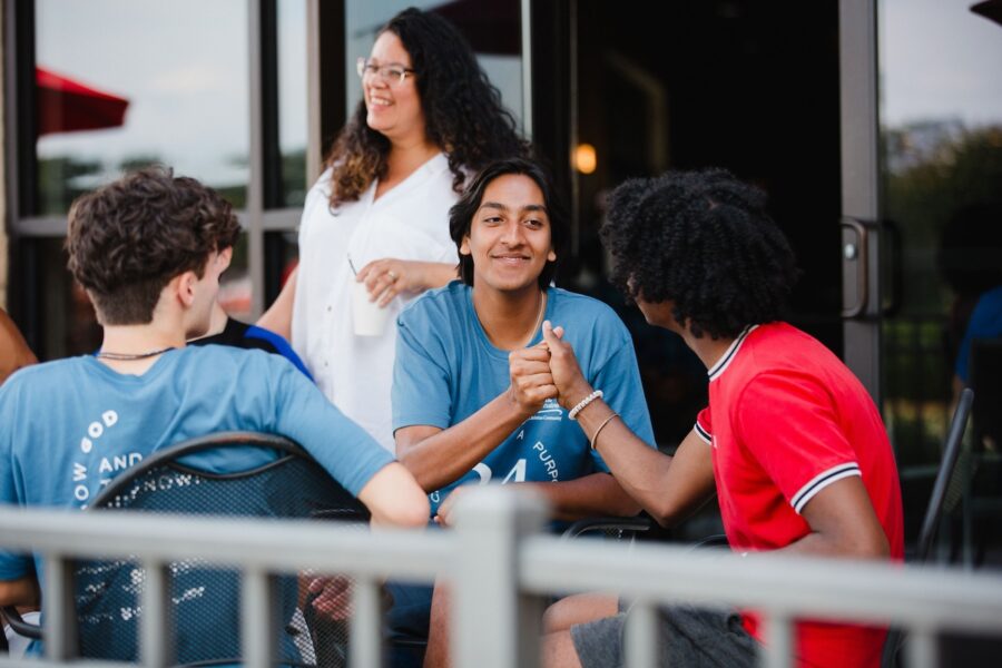 Students shaking hands at a Classical Conversations community