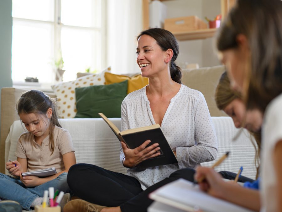 a Classical Conversations director leading children in reading