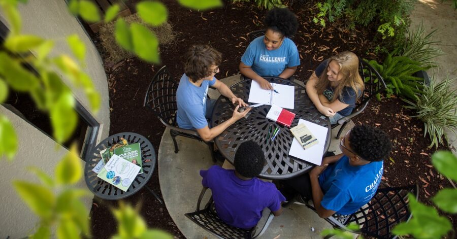 Challenge students sitting in a circle - CC Plus