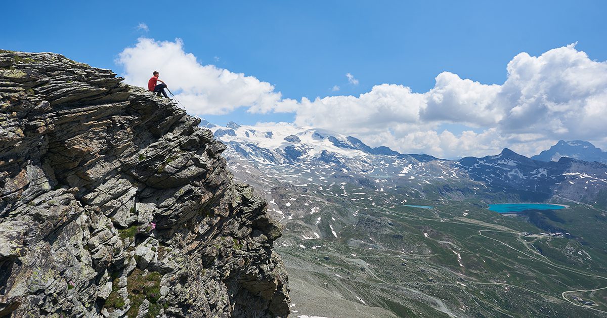 A young man overcomes a challenge.