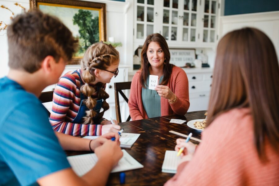 a homeschool family learn with the Classical Conversations math flashcards