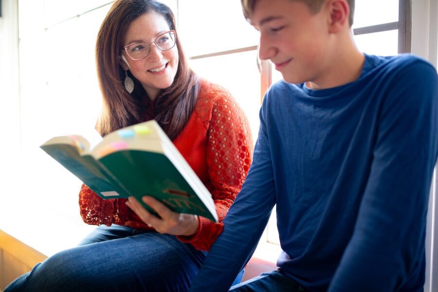 A homeschool mom reads to her son