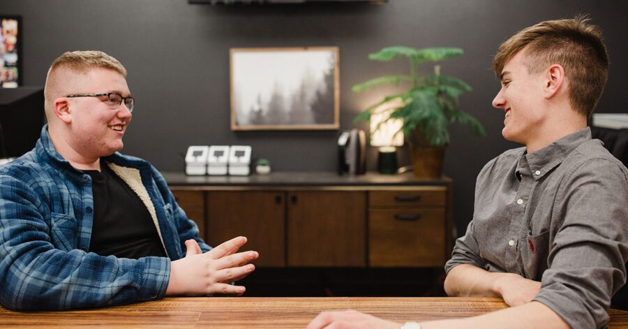 Two homeschool high school students having a discussion