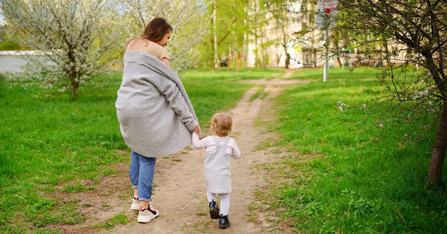 Mom and toddler walking together, she is already homeschooling
